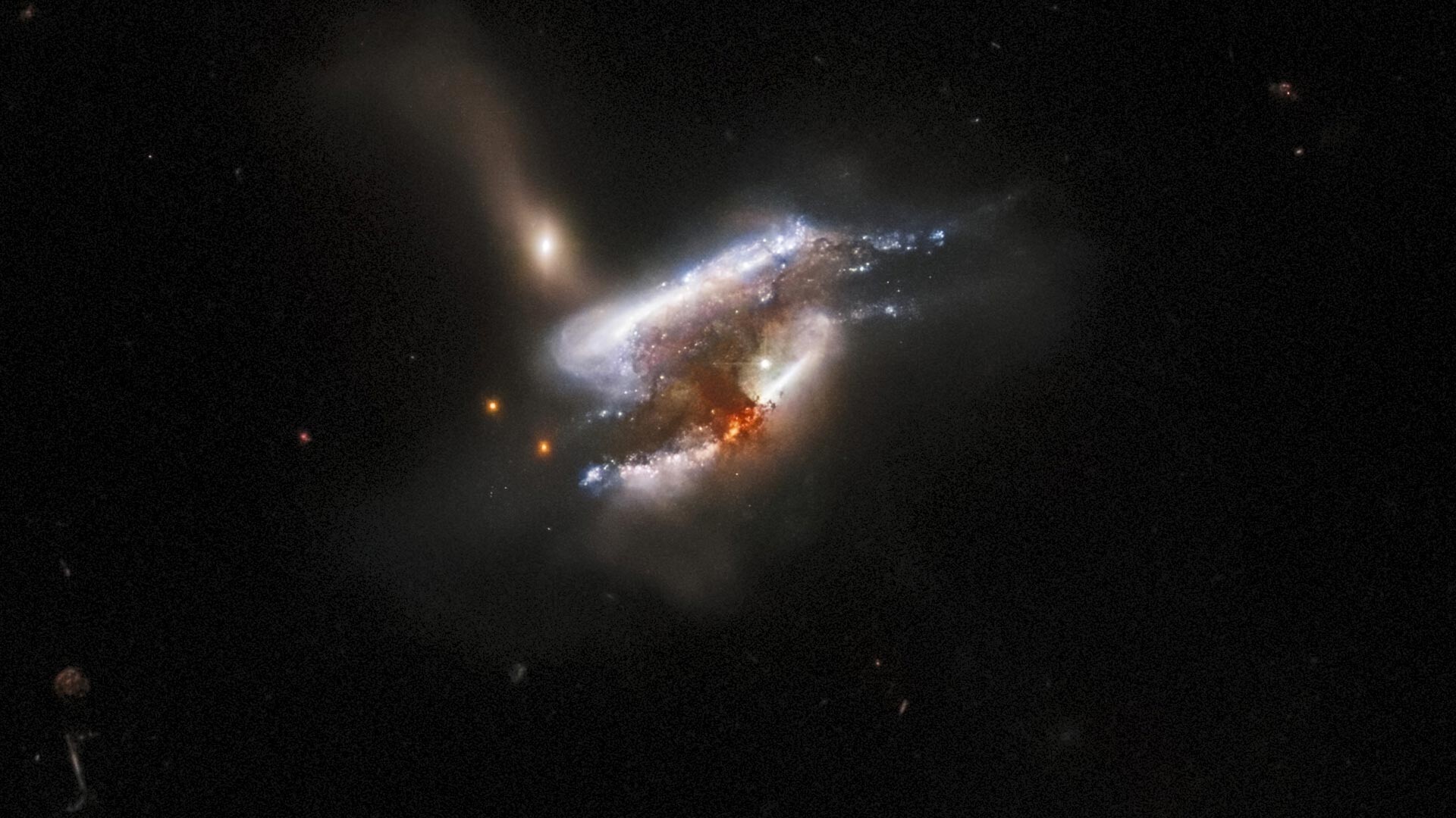 Hubble Captures a Tumultuous Galactic Trio